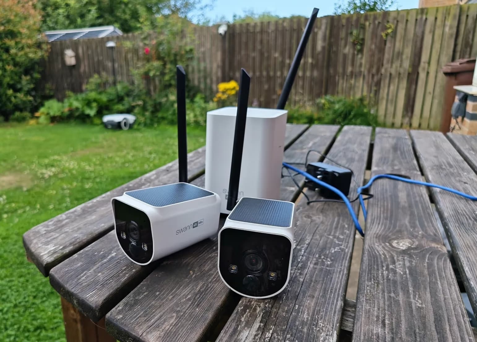 Outdoor security camera mounted for driveway and porch coverage