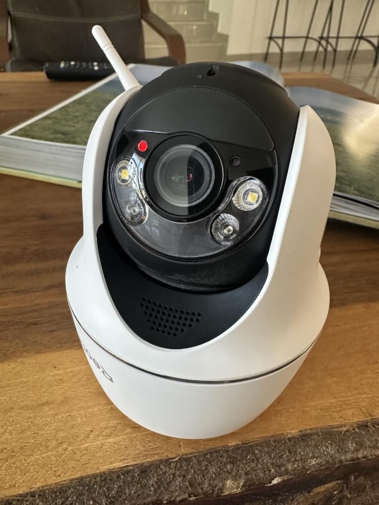 Reolink Argus PT Ultra close-up showing lens, spotlight LEDs, and two-way speaker