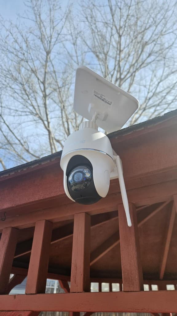 Argus PT Ultra solar panel camera mounted outdoors under a wooden eave
