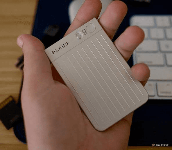 PLAUD Note Pro held in hand showing dual-engine controls