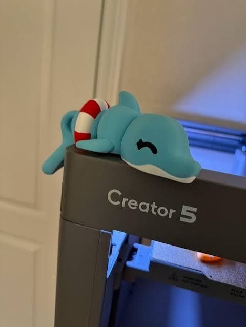 Flashforge Creator 5 top frame close-up with a small blue dolphin print