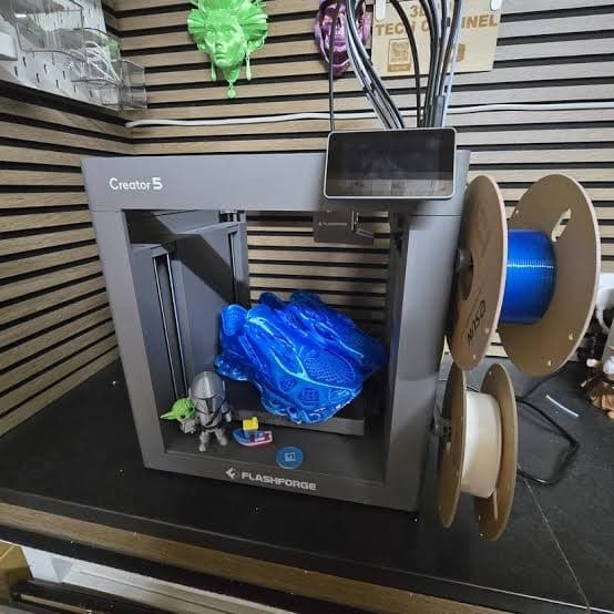 Flashforge Creator 5 open-frame 3D printer printing a large multicolor blue model